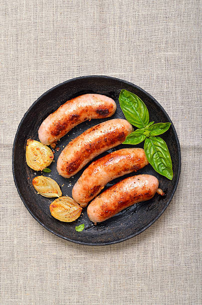 istock Grilled sausages in frying pan 629764056