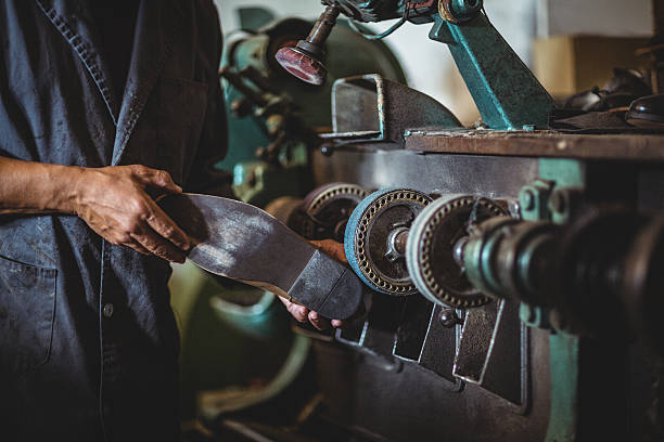 istock Shoemaker polishing a shoe with machine 629764098