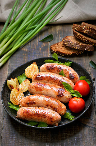 istock Barbecue sausages in frying pan 629764406