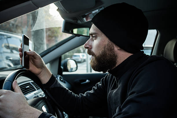 istock Traffic offenses man with smartphone driving 629764434