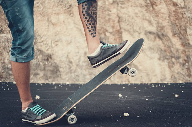 istock Closeup of skateboarder legs 629767674