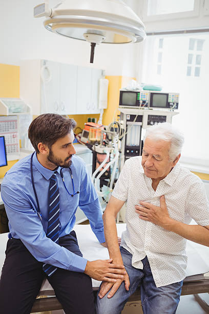 istock Male doctor examining a patient 629767676
