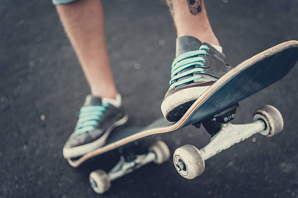 istock Close up of a skateboarders feet while skating 629767778