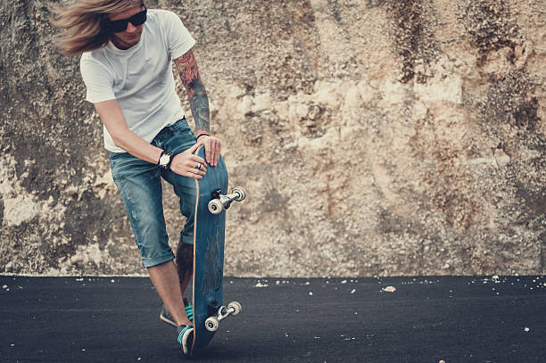 istock Man doing skateboard trick outdoor. 629768064