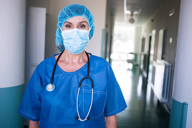 istock Portrait of surgeon standing in corridor 629771244