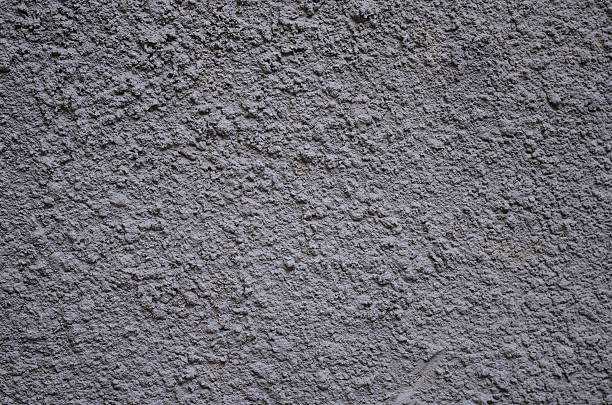 istock Gray plaster weathered wall with stains and cracks 629776198