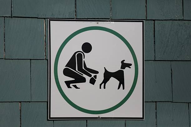 Sign indicating pick up behind your dog