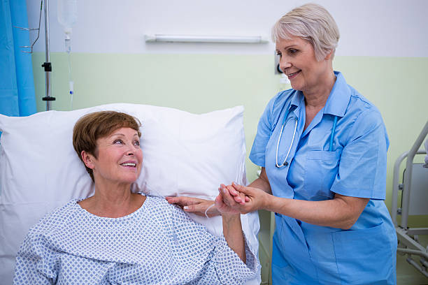 istock Nurse talking to a senior patient 629777304