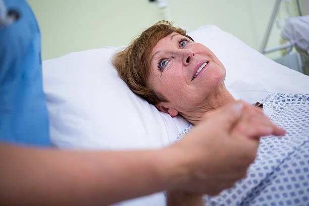 istock Senior patient talking to a nurse 629777308