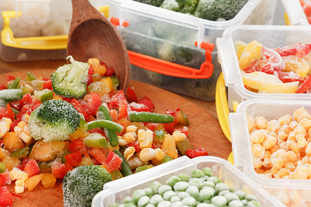 istock Frozen vegetables healthy food. Cooking from packaging ingredients. 629778464