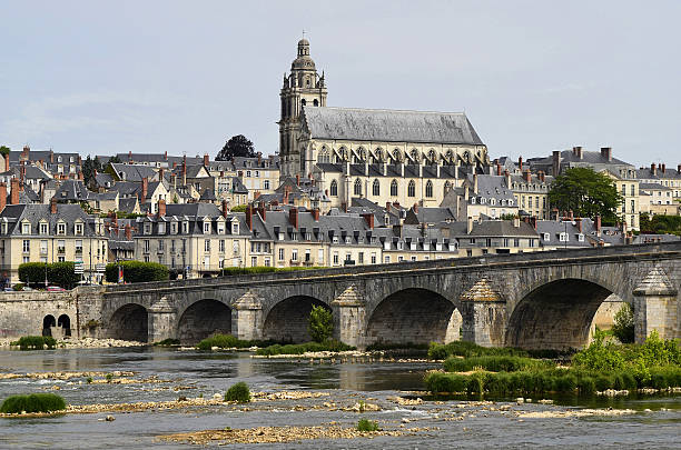 France, Blois Blois, France, cathedral and old bridge over Loire river blois stock pictures, royalty-free photos & images