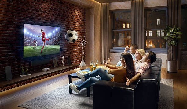 istock Couples watching very realistic Soccer game on TV 629779642