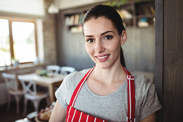 istock Portrait of female baker smiling 629779970