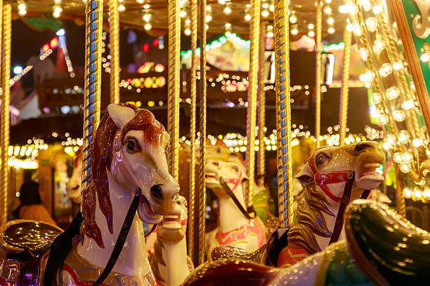 Merry-go-round in Winter Wonderland Merry-go-round in Winter Wonderland, a Christmas fair in London winter wonderland london stock pictures, royalty-free photos & images