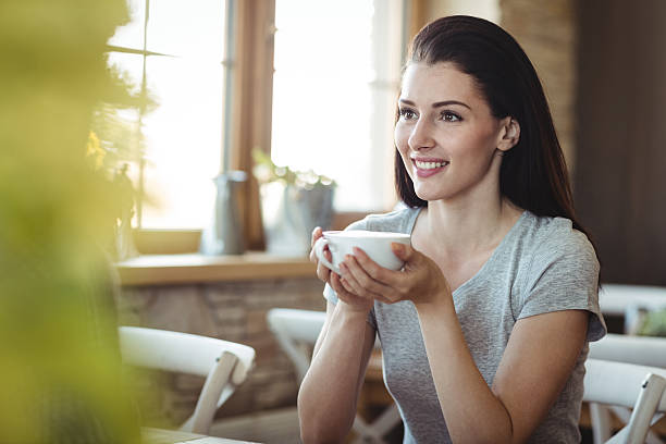 istock Woman holding a cup of coffee 629780444