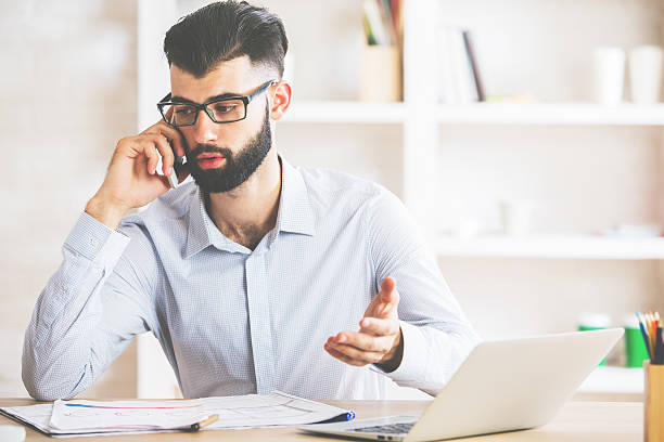 istock Attractive businessman on phone 629780492
