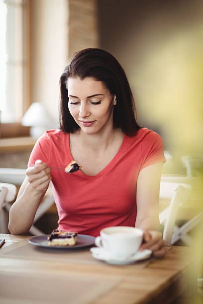 istock Woman having a slice of cake 629780952