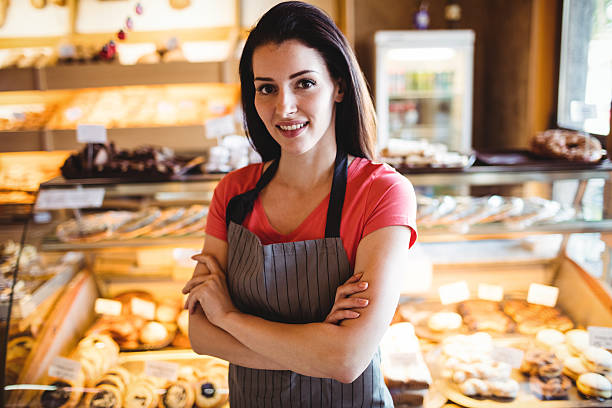 istock Portrait of female baker smiling 629781238
