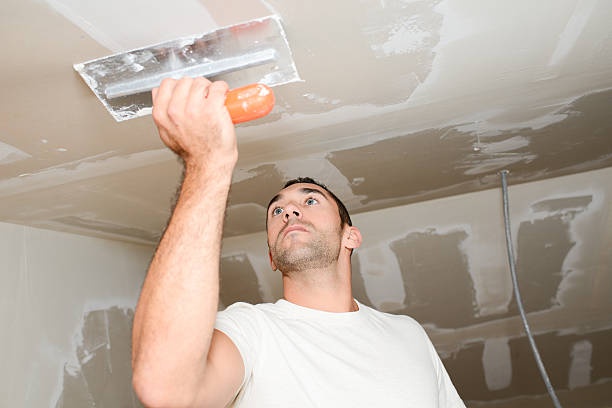 istock construction industry worker plastering renovating house plaster construction site 629782480