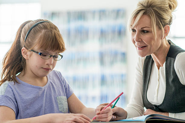 istock Tutoring a Girl with a Visual Impairment 629782852