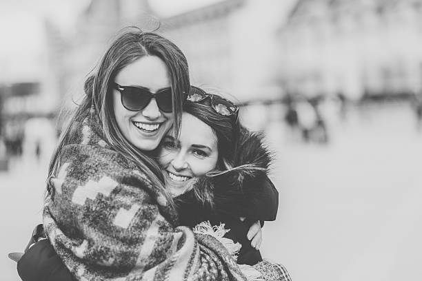 Best friends hugging outside