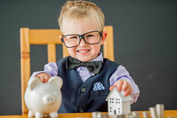 istock Putting Coins in a Piggy Bank 629783390