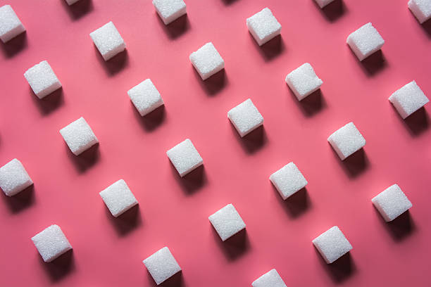 분홍색 배경에 패턴 설탕 큐브 - sweetening 뉴스 사진 이미지