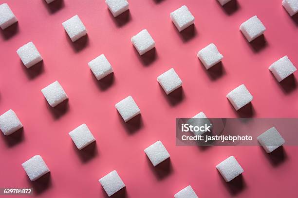 Pattern Sugar Cubes On A Pink Background Stock Photo - Download Image Now - Sugar - Food, Sugar Cube, Pattern
