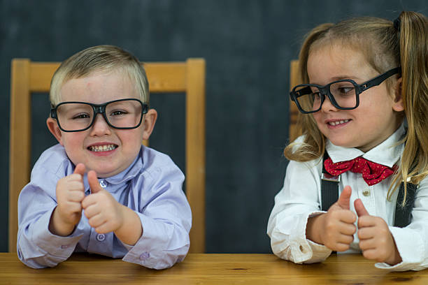 istock Two Children Holding Their Thumbs Up 629785248
