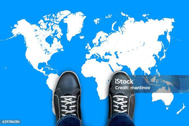 Black Casual Shoes Standing On World Map Stock Photo - Download Image Now - In Front Of, World Map, Adult