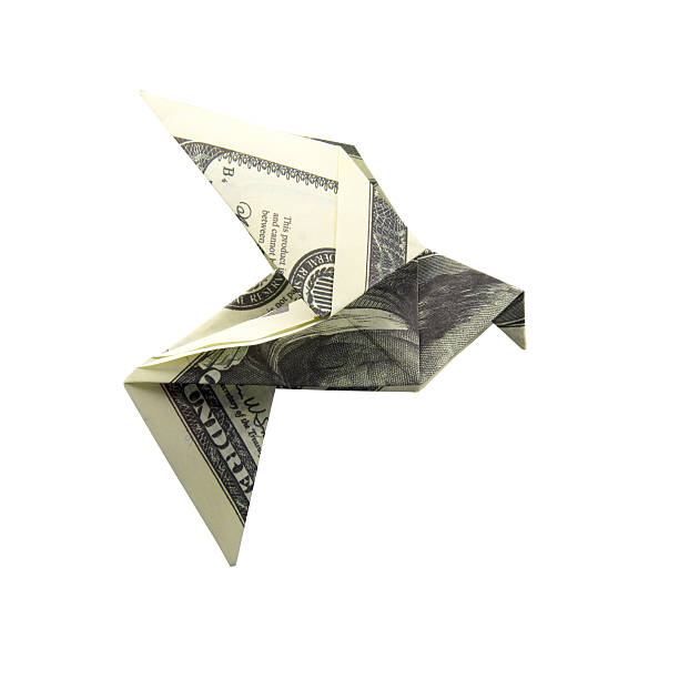 Origami Bird from banknotes Origami Bird from banknotes on a white background origami money bird stock pictures, royalty-free photos & images