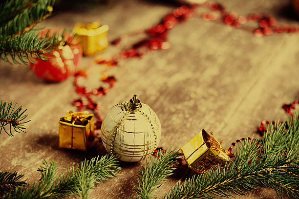 istock Christmas balls, gift boxes and fir tree branch 629789030