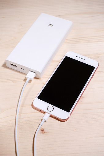 istanbul, Turkey - December 10, 2016:White iphone 7 phone charger with power bank (battery bank)