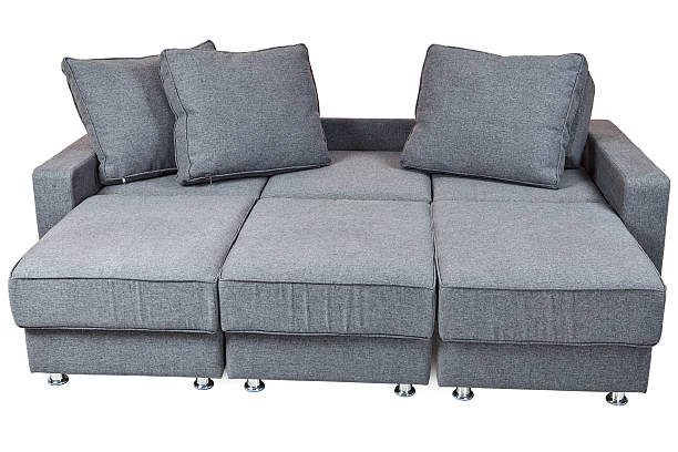 istock convertible fabric sofa bed futon dark grey color, isolated 629789508
