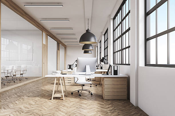 istock Front view of a long office with wooden floor 629789862