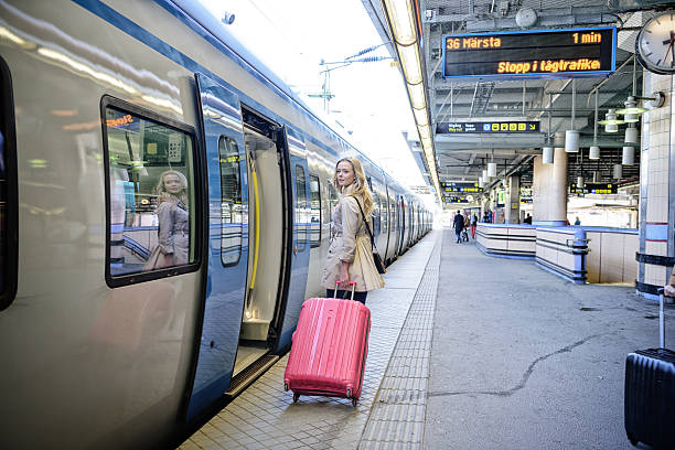 istock Blonde Swedish woman exiting commuter subway train 629793090