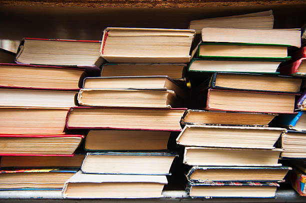 istock Old books on book shelf background 629795154