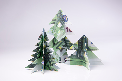 Christmas tree origami made of banknotes euro. Handmade