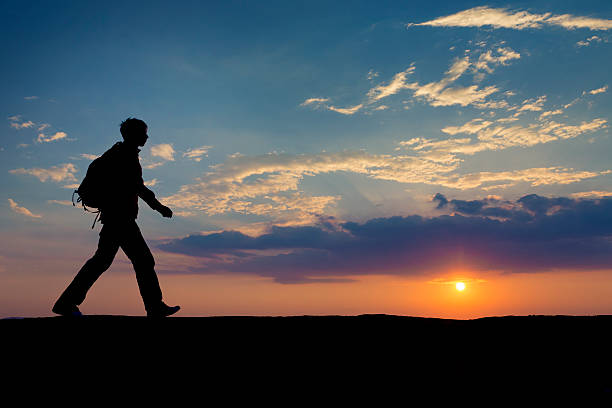 Sunset hiker stock photo