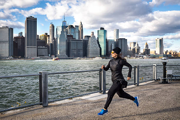 istock Female athlete jogging on the pier 629799064