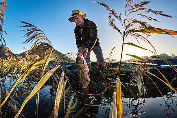 istock Fisherman in the boat 629799926