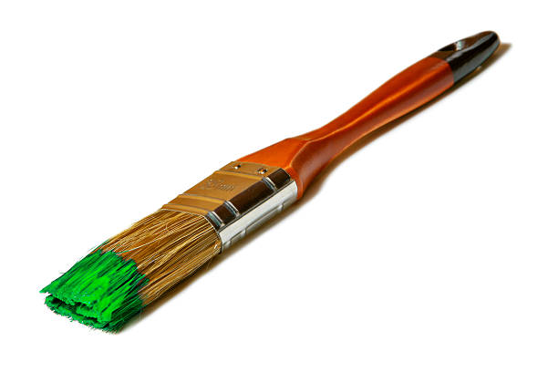 istock Paintbrush with green paint (isolated on white) 629800042