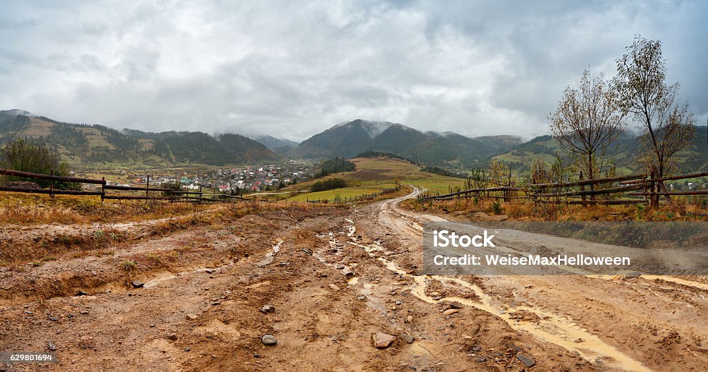 Muddy ground after rain in mountains. Extreme rural dirt road Muddy ground after rain in Carpathian mountains. Extreme path rural dirt road in the hills Mud Stock Photo