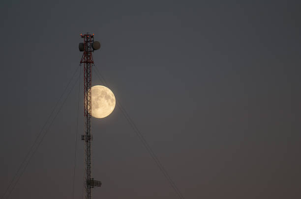 moon and communications tower - full moon audio imagens e fotografias de stock