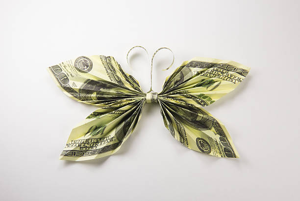 istock dollars in the form of butterflies 629803888