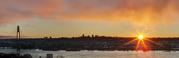 istock panorama of sunrise over cities at riverside 629804056