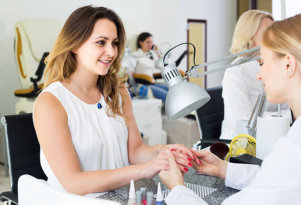 istock Female clients doing nails in nail salon in afternoon 629804212