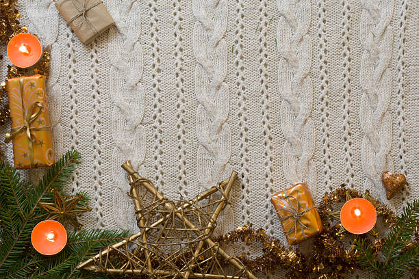 istock Christmas decoration frame with knitted wool background. Space f 629804548