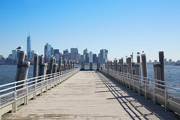 istock New York city skyline and empty pier with seagulls 629805490