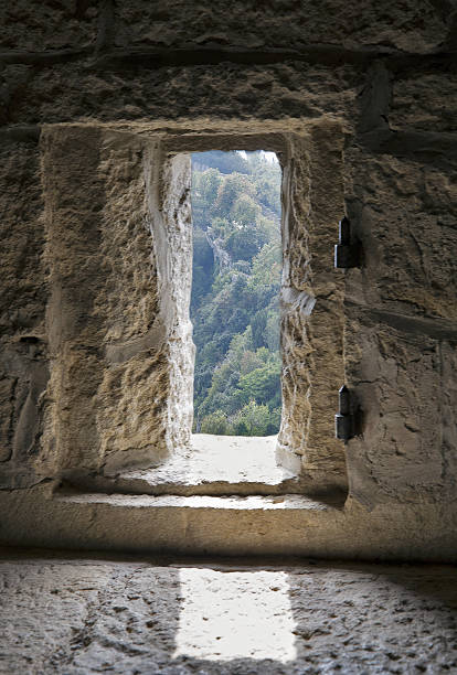 Window in a medieval castle with landscape of San Marino.